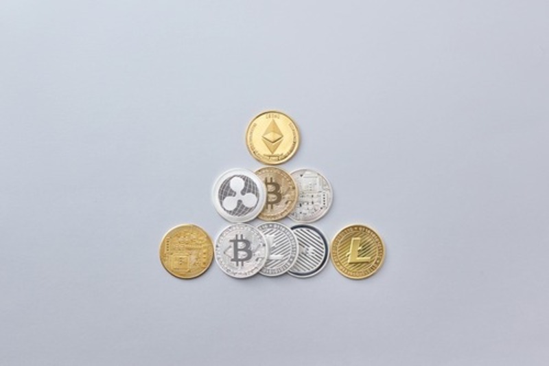 Ethereum (ETH), Bitcoin (BTC), and Litecoin (LTC) cryptocurrency coins stacked together
